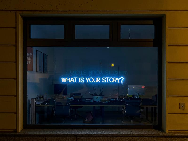 What is your story? Words projected on a window. 